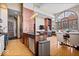 Bright living room features large arched windows, hardwood floors and connects to the kitchen at 1529 N Alabama N St # B, Indianapolis, IN 46202