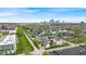 The neighborhood and the city skyline in the distance are visible from this aerial view of the property at 1655 Cornell Ave, Indianapolis, IN 46202