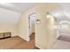 A carpeted attic room featuring an open doorway, and small shelving unit at 1655 Cornell Ave, Indianapolis, IN 46202