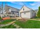 Backyard featuring a pergola, hot tub, privacy fence, and lush lawn at 1655 Cornell Ave, Indianapolis, IN 46202