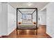 Elegant bedroom with wood floors, modern bed frame, and ample natural light at 1655 Cornell Ave, Indianapolis, IN 46202