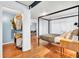 Spacious bedroom with a four-poster bed, hardwood floors, and closet at 1655 Cornell Ave, Indianapolis, IN 46202