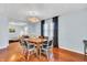 Bright dining room with hardwood floors, modern chandelier, and large windows at 1655 Cornell Ave, Indianapolis, IN 46202