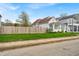 Charming single-Gathering home featuring a fenced yard, mature trees, and a light-filled sunroom at 1655 Cornell Ave, Indianapolis, IN 46202