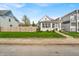Charming house featuring a well-maintained lawn, complemented by beautiful landscaping and a cozy front porch at 1655 Cornell Ave, Indianapolis, IN 46202