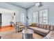 Bright living room with carpet, comfortable seating, stylish decor, and large windows at 1655 Cornell Ave, Indianapolis, IN 46202