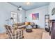 Cozy living room with carpet, comfortable seating, stylish decor, and natural light at 1655 Cornell Ave, Indianapolis, IN 46202
