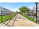 Paved walking trail near 17th street showcasing a beautiful tree-lined path near apartment buildings at 1655 Cornell Ave, Indianapolis, IN 46202
