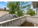 Balcony with wood floors and a white railing at 1665 N College Ave, Indianapolis, IN 46202