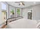 Bedroom with hardwood floors, bay windows and view to the ensuite bathroom at 1665 N College Ave, Indianapolis, IN 46202