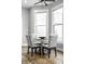 Charming dining area with table and chairs near a bright window at 1665 N College Ave, Indianapolis, IN 46202