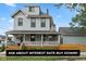Charming two-story home with a welcoming front porch, beautiful landscaping, and attractive curb appeal at 1665 N College Ave, Indianapolis, IN 46202