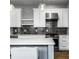 Stylish kitchen with stainless appliances, a marble island, and a tile backsplash at 1665 N College Ave, Indianapolis, IN 46202
