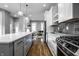 Modern kitchen with stainless steel appliances and marble countertops at 1665 N College Ave, Indianapolis, IN 46202
