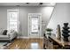 Inviting living room with a cozy seating area, natural light, and hardwood floors, offering a relaxed ambiance at 1665 N College Ave, Indianapolis, IN 46202