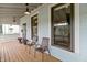 Relaxing porch with two chairs and flowers, perfect for enjoying the outdoors at 1665 N College Ave, Indianapolis, IN 46202