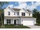 Charming two-story home with white siding, covered porch, and attached two-car garage at 16829 Silo Meadows Dr, Noblesville, IN 46060