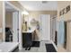 Bathroom featuring a dark vanity, tiled floors, walk-in shower and convenient access to the bedroom at 2282 Creekland Dr, Columbus, IN 47201