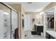 Bright bathroom featuring a tiled floor, modern vanity, and glass-enclosed shower, offering a clean design at 2282 Creekland Dr, Columbus, IN 47201