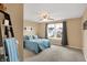 Comfortable bedroom with ceiling fan, large window and stylish accents offers a relaxing and inviting atmosphere at 2282 Creekland Dr, Columbus, IN 47201