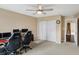 Spacious bedroom featuring carpet floors, ceiling fan, and a double-door closet at 2282 Creekland Dr, Columbus, IN 47201