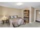 Charming bedroom with a comfortable bed, a stylish bookcase, and soft, neutral tones at 2282 Creekland Dr, Columbus, IN 47201