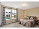 Cozy bedroom featuring a comfortable bed, neutral walls, and a window view of the neighborhood at 2282 Creekland Dr, Columbus, IN 47201