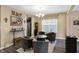 Cozy dining area with modern lighting, comfortable chairs, and a view into the kitchen with stainless steel appliances at 2282 Creekland Dr, Columbus, IN 47201