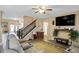 The living room has comfortable sofas, a ceiling fan, and a flat screen TV at 2282 Creekland Dr, Columbus, IN 47201