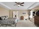 This bedroom features a tray ceiling, ceiling fan, and an ensuite bathroom, creating a private retreat at 2282 Creekland Dr, Columbus, IN 47201