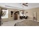 Bright, airy bedroom with large windows, ceiling fan, and stylish decor, perfect for relaxation and comfort at 2282 Creekland Dr, Columbus, IN 47201