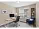 Modern home office with a sleek desk, comfortable chair, and bright window view at 2282 Creekland Dr, Columbus, IN 47201