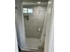 This bath features a custom tile shower with white hexagon tile flooring at 2813 Collier St, Indianapolis, IN 46241