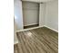 Bedroom features wood-look flooring and closet with closet rod at 2813 Collier St, Indianapolis, IN 46241