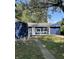 Charming home featuring blue siding, white trim, and a well-manicured front lawn at 2813 Collier St, Indianapolis, IN 46241