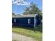 Charming blue home with fenced yard and mature trees at 2813 Collier St, Indianapolis, IN 46241