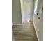 Hallway has wood-look floors and neutral paint with natural light at 2813 Collier St, Indianapolis, IN 46241