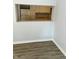 An open window shows the kitchen that has white cabinets and neutral countertops at 2813 Collier St, Indianapolis, IN 46241