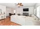 Spacious living room showcasing hardwood floors, a cozy fireplace, and dining area at 3147 Bonham Dr, Indianapolis, IN 46222