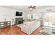 Bright living room featuring hardwood floors, fireplace, and access to the outdoor patio at 3147 Bonham Dr, Indianapolis, IN 46222