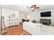 Bright living room featuring hardwood floors, a fireplace, and a dining area at 3147 Bonham Dr, Indianapolis, IN 46222