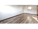 Bright bedroom featuring a window and wood-look flooring at 321 Pleasantview Dr, Greenwood, IN 46142