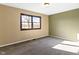 Bedroom featuring neutral walls, carpet, and a window providing natural light at 321 Pleasantview Dr, Greenwood, IN 46142