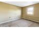 Bedroom with neutral walls, carpeted floors, and a window, offering a cozy space at 321 Pleasantview Dr, Greenwood, IN 46142