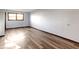 Bright, simple bedroom featuring a window and wood-look flooring at 321 Pleasantview Dr, Greenwood, IN 46142