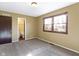 Bedroom featuring a window, carpet, and connecting door to a bathroom at 321 Pleasantview Dr, Greenwood, IN 46142