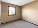 Cozy bedroom featuring neutral walls, plush carpet, and natural light from a window at 321 Pleasantview Dr, Greenwood, IN 46142