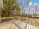 Relax on the spacious deck with lovely natural views and a painted wood railing at 321 Pleasantview Dr, Greenwood, IN 46142