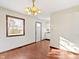 Dining room with hardwood floors, chandelier, and a view of the kitchen at 321 Pleasantview Dr, Greenwood, IN 46142