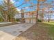 Charming split-level home with a two-car garage and mature trees in a suburban neighborhood at 321 Pleasantview Dr, Greenwood, IN 46142